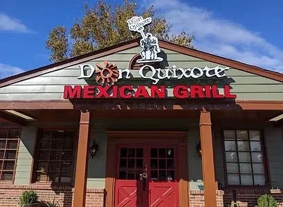 Exterior of Don Quixote Mexican Grill with signage and rooftop cutout.