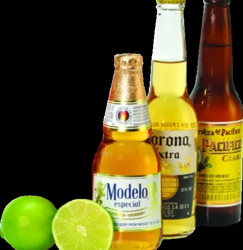 Modelo, Corona, Pacifico beer bottles with whole and sliced limes.