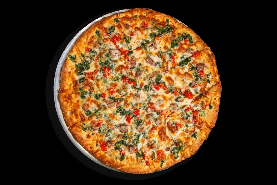 Sliced pizza with cheese, vegetables, and meat on a black background.