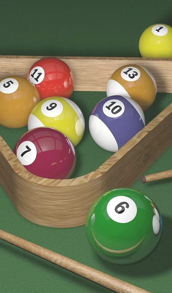 Close-up of colorful billiards balls, cues, and pocket on green felt.