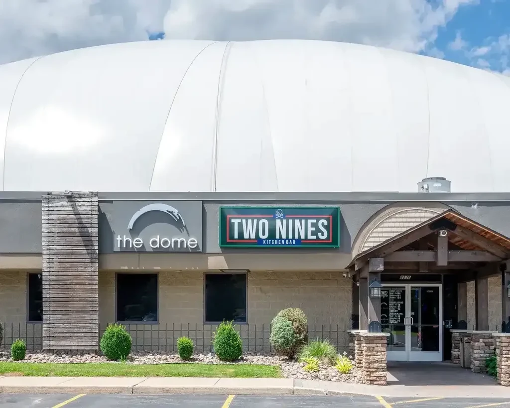 Two Nines Kitchen Bar entrance below a large white inflatable dome.