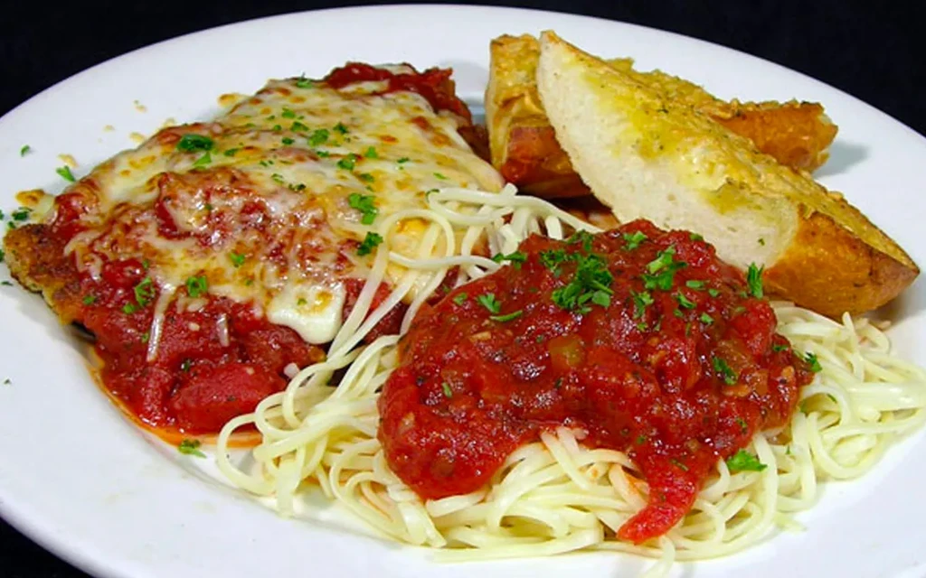 Italian-American chicken/veal parmesan with spaghetti and garlic bread.