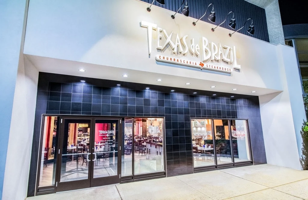 Texas de Brazil Churrascaria Steakhouse exterior with illuminated sign and windows.