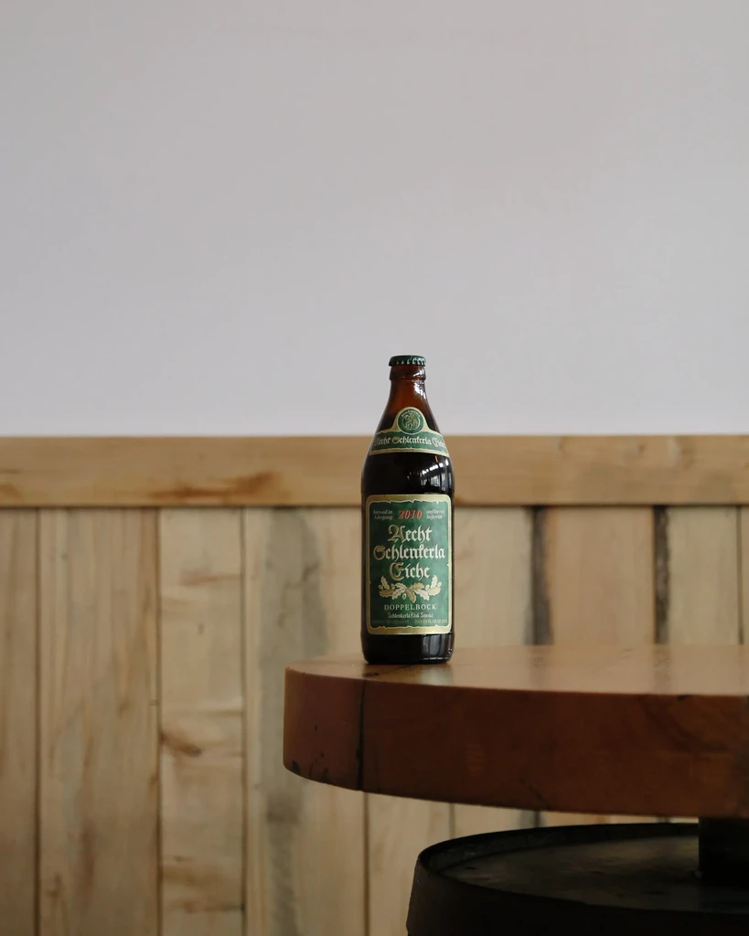 Brown glass beer bottle labeled 'Schlenkerla Eiche Doppelbock 2010'.