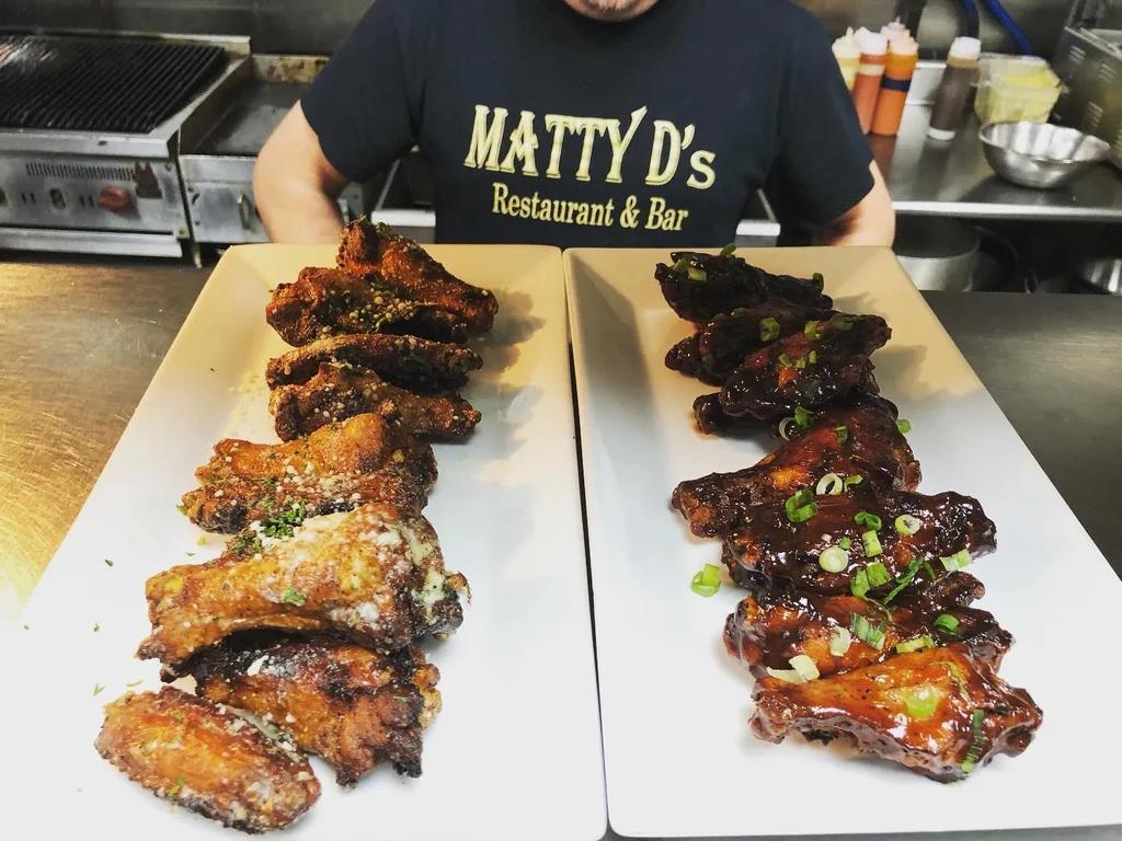 Matty D's chicken wings: parmesan herb and dark sauced.