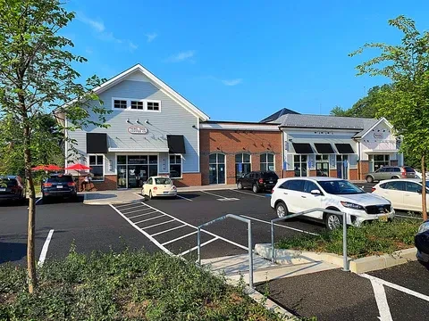 Periwinkle Coffee Co. in a modern commercial complex with parking.