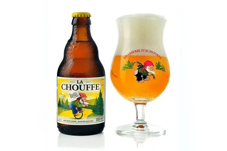 Cold La Chouffe beer bottle and glass with gnome branding.