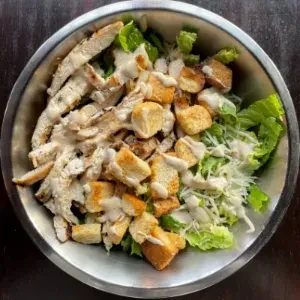 Caesar salad with grilled chicken, croutons, Parmesan, and creamy dressing.