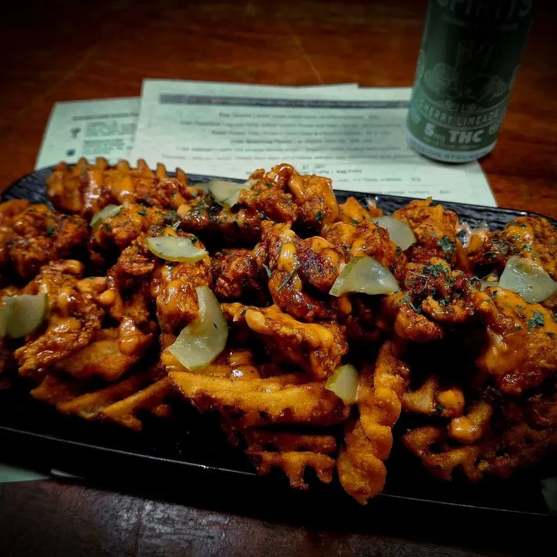 Waffle fries, fried chicken, orange sauce, pickles, 5mg THC drink.
