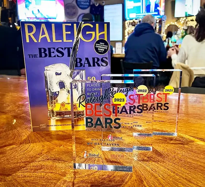 Raleigh Best Bars awards, 2021-2023, with a magazine on a bar.