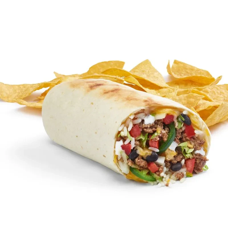 Close-up of a grilled burrito cross-section revealing vibrant fillings.