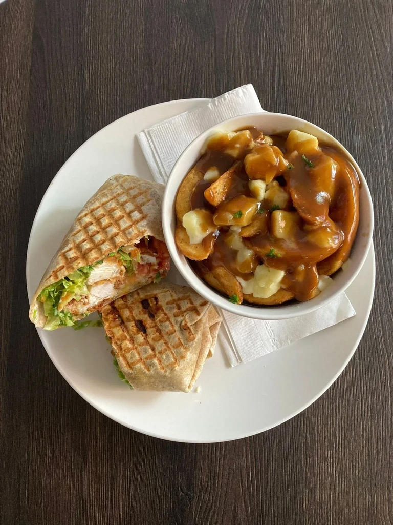 Grilled fried chicken wrap, poutine with fries, cheese curds, gravy.