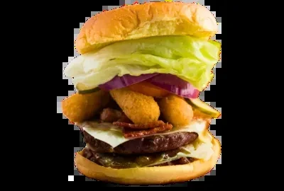 Large, stacked burger with bacon, melted cheese, and fried cylindrical items.