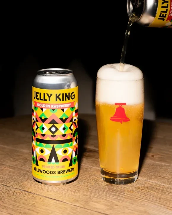 Jelly King Golden Raspberry beer can, golden beer pouring into a glass.