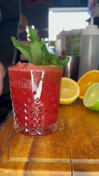 Red Buffalo Trace crushed ice cocktail with mint and citrus.