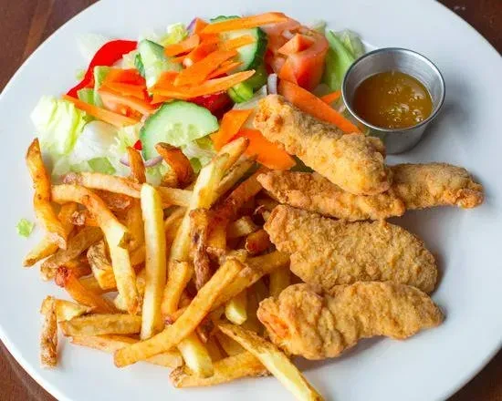 Overhead plate of chicken tenders, french fries, side salad, and sauce.