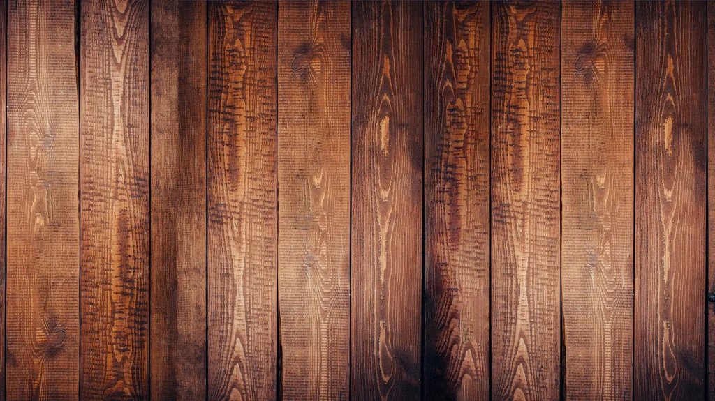 Rustic medium-dark brown vertical wooden planks showing natural grain.
