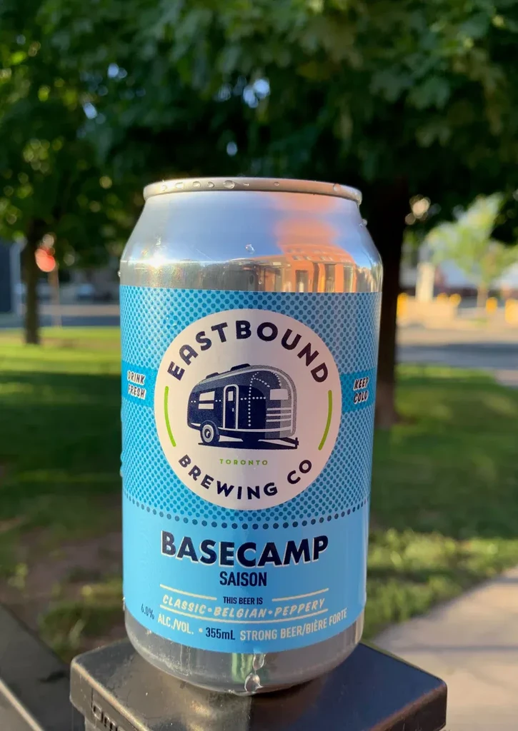Cold Eastbound Basecamp Saison can, travel trailer logo, condensation.