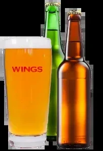 Three beers: a WINGS glass and two capped green, amber bottles.