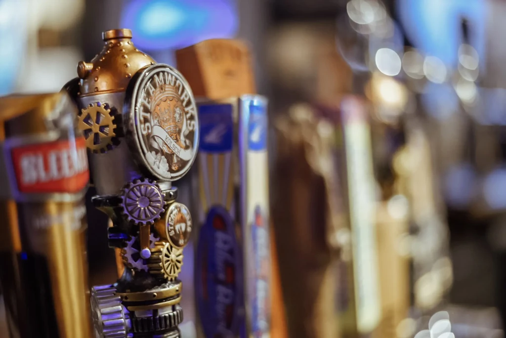 Steampunk beer tap handle with 'Steamworks Kölsch' text.