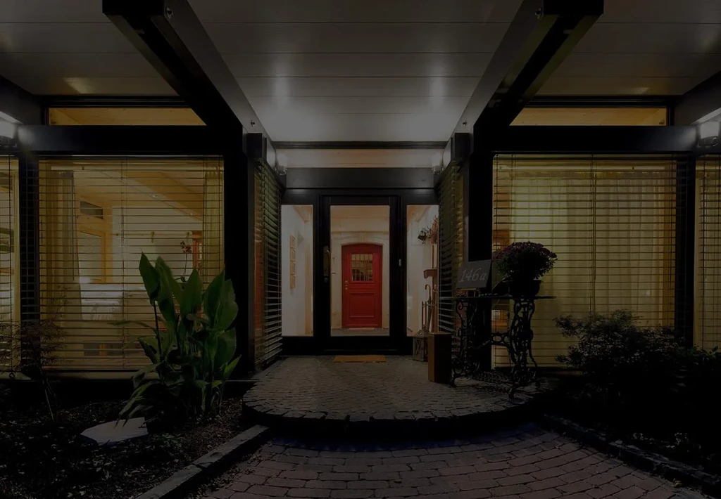 Night view: Modern entrance, red door, illuminated interior, address 146a.