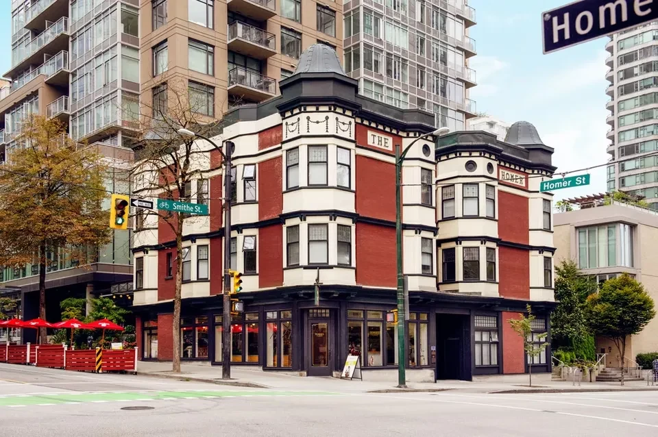 The Homer, a red brick restaurant with an outdoor patio.