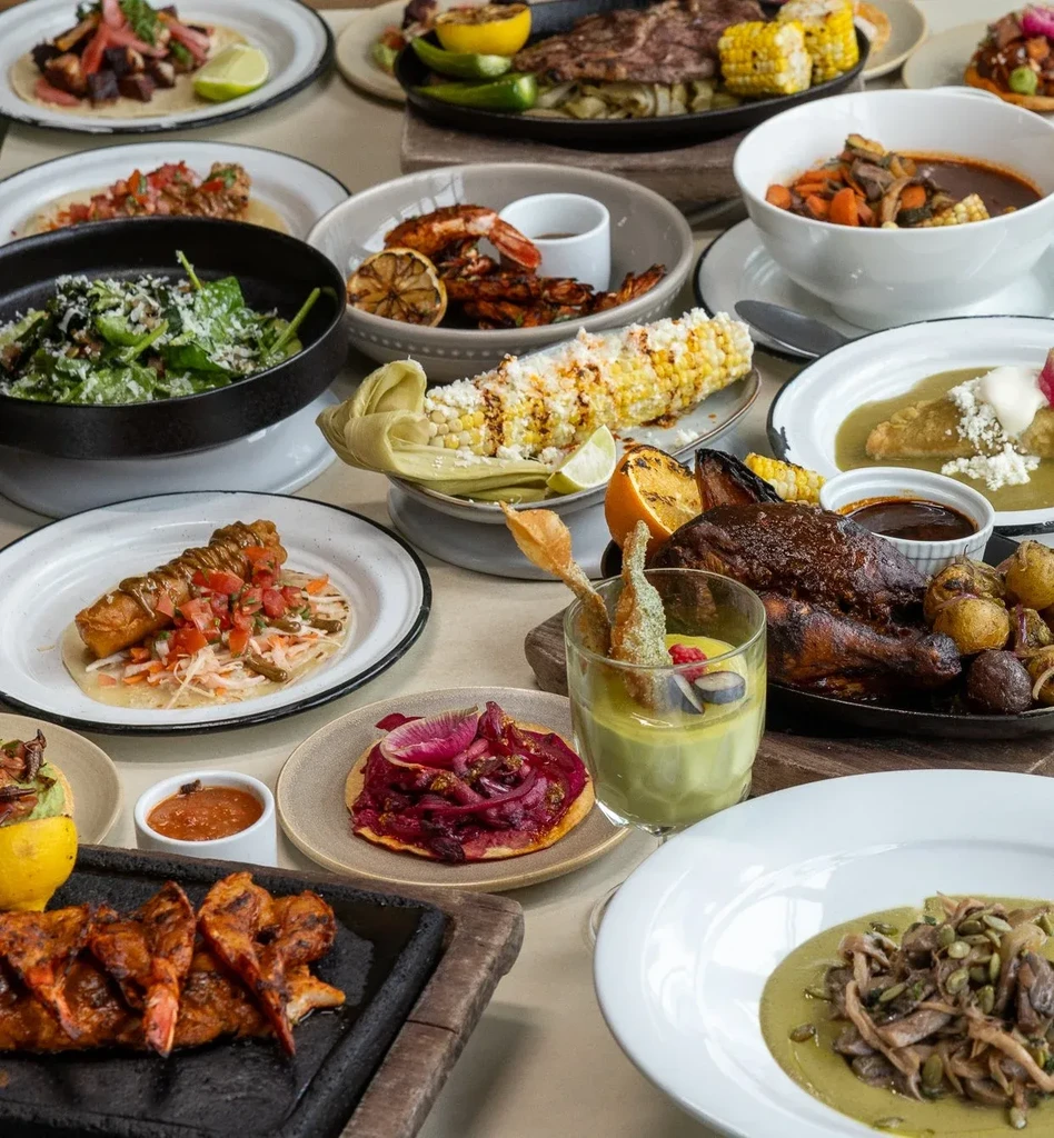 A vibrant spread of various Mexican and Latin American dishes.