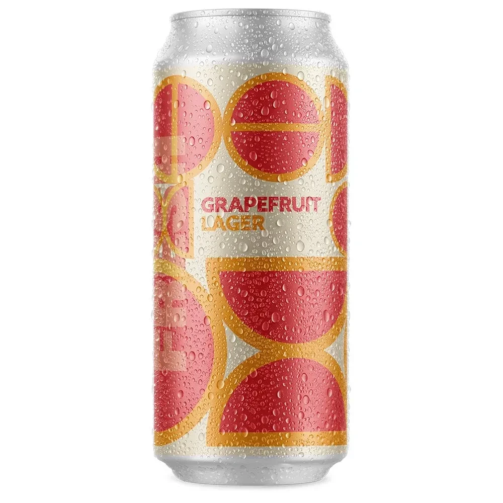 Cold grapefruit lager can with condensation on white background.