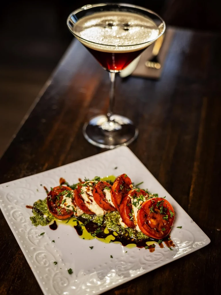 Grilled tomato Caprese salad with pesto, balsamic, and espresso martini.