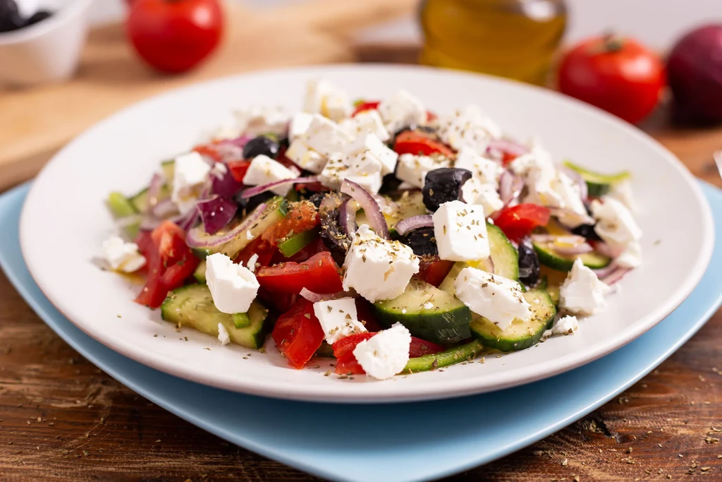 Fresh Greek salad with diced tomatoes, cucumbers, feta, and black olives.