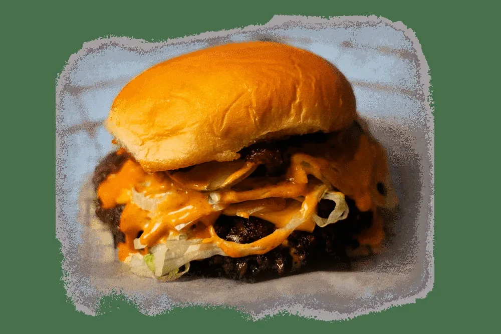 Large smash burger with brioche, melted cheese, pickles, and lettuce.