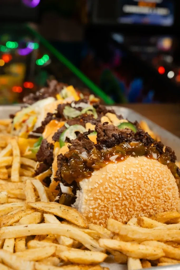 Loaded hot dogs with chili, cheese, jalapeños, and golden fries.
