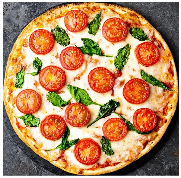 Top-down pizza with mozzarella, cherry tomatoes, and basil on a dark surface.