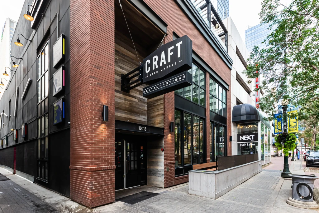 Modern urban exterior of CRAFT Beer Market restaurant and bar.