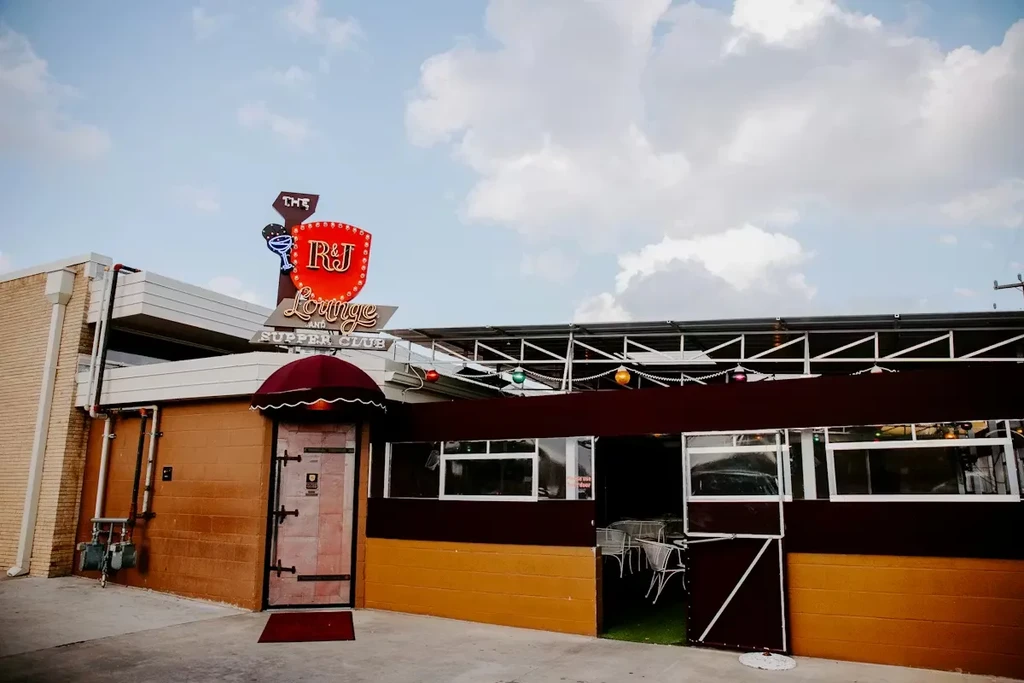 R&J Lounge and Supper Club building exterior, multi-toned facade, outdoor patio.