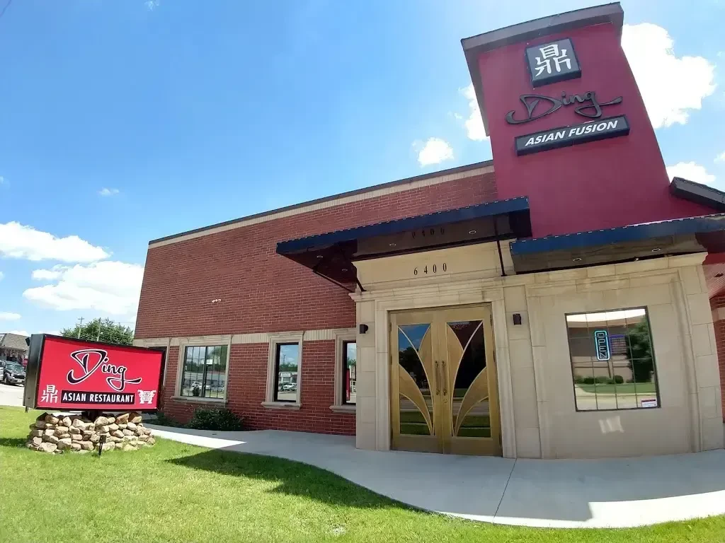 Ding Asian Fusion restaurant exterior, red sign, elaborate golden doors.
