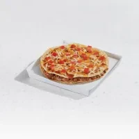 Mexican pizza with melted cheese, diced tomatoes, and meat filling.