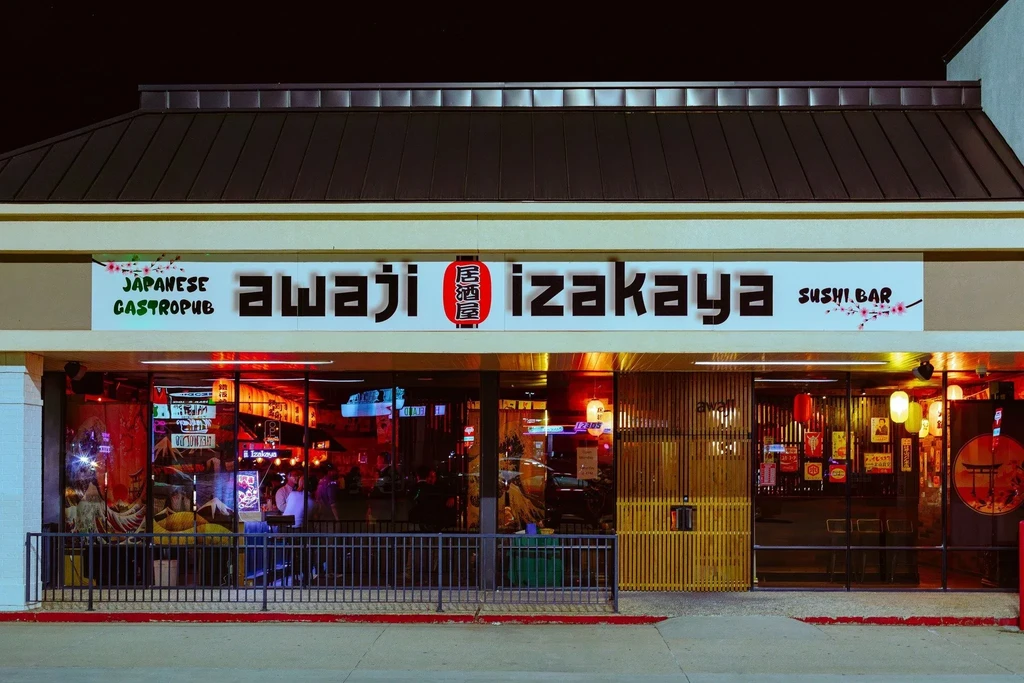 Awaji Izakaya Sushi Bar, a brightly lit Japanese gastropub exterior.