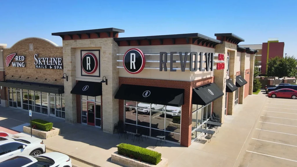 Exterior of Revolve Kitchen & Bar, Red Wing, and Skyline Nails.