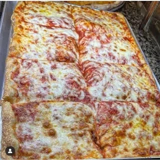 A rectangular tray of pizza with eight slices of melted cheese and sauce.