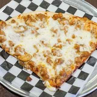 A slice of chicken pizza on a metal plate with a checkered paper.