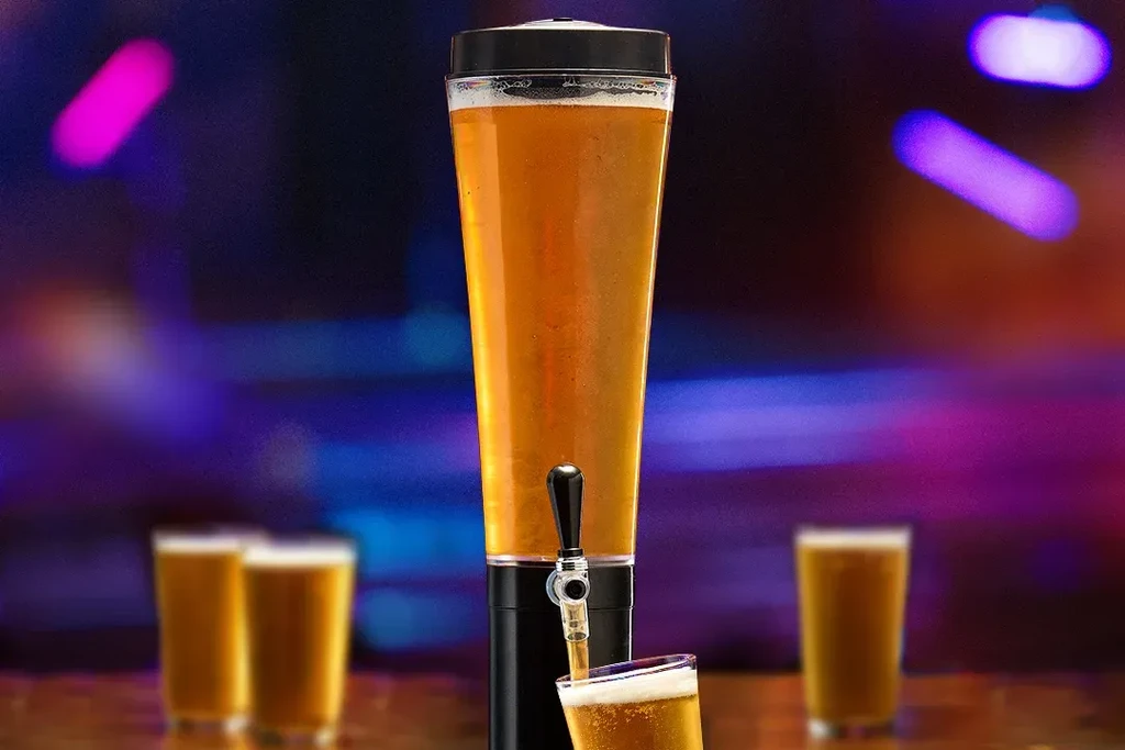 Tall beer dispenser pouring beer into a glass on a bar.