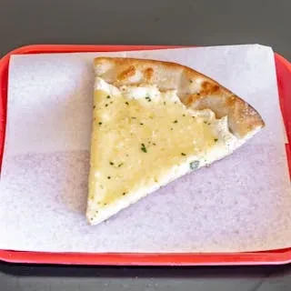 A single slice of plain white pizza on white paper in a red tray.