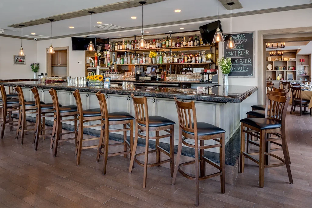 Well-stocked restaurant bar with liquor, beer taps, and food menu.