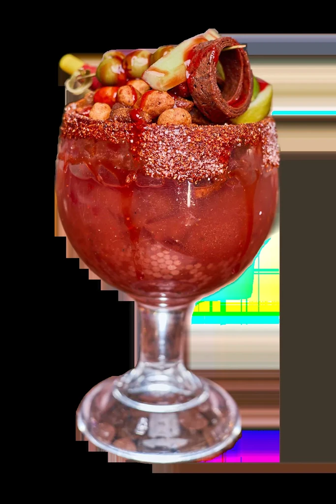 Close-up of a heavily garnished Michelada cocktail with a chili-lime rim.