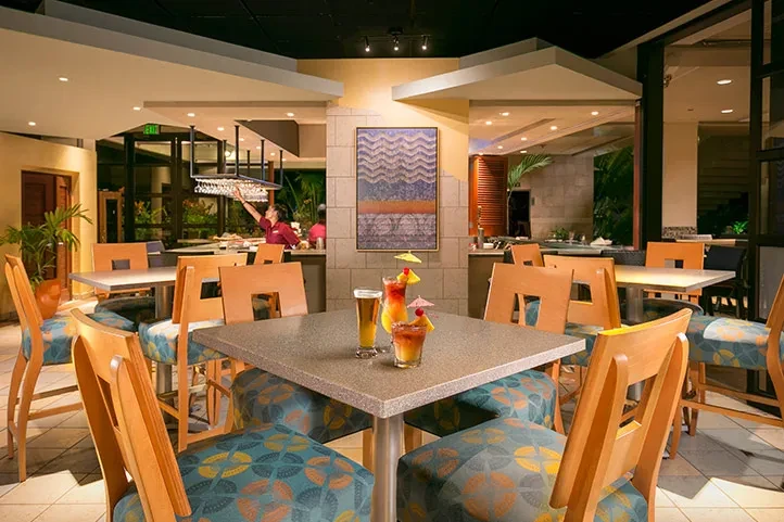 Colorful cocktails on a table in a modern restaurant bar.