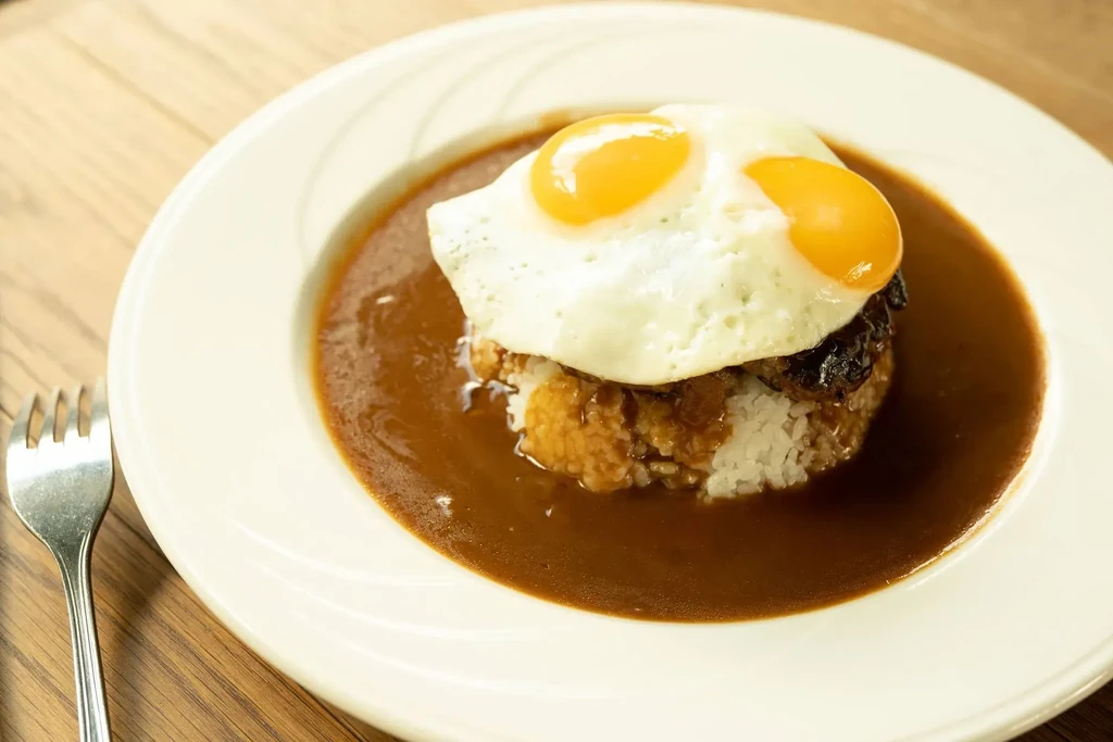 Loco Moco: rice, hamburger patty, gravy, and two fried eggs.