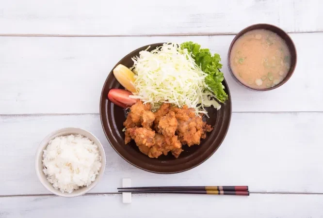 Karaage set meal with miso soup and rice.