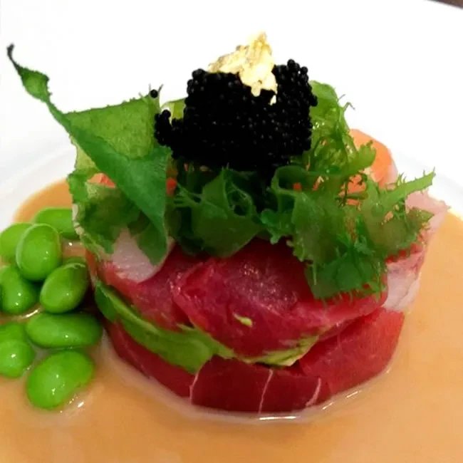 Tuna and avocado tartare topped with caviar and gold leaf.