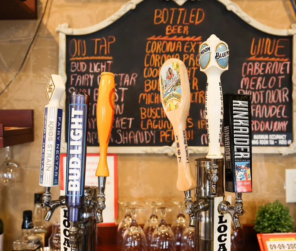 Various beer taps, including Bud Light, and a bar menu.